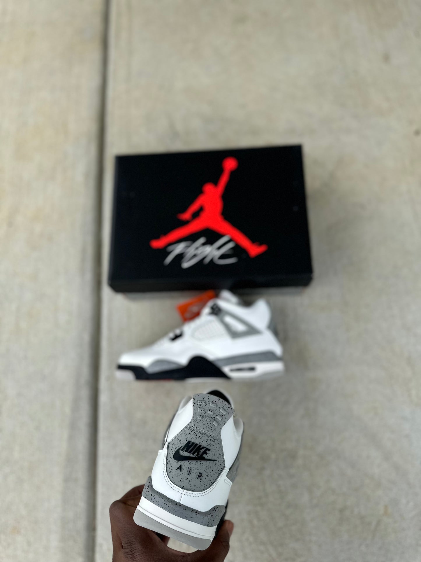 Jordan 4 Retro “White Cement” (2025)