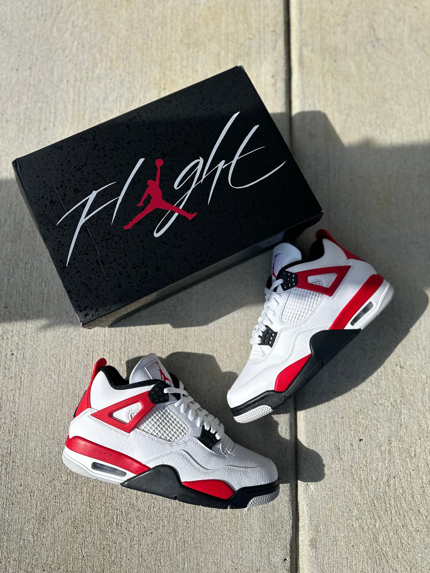 Jordan 4 Retro “Red Cement”